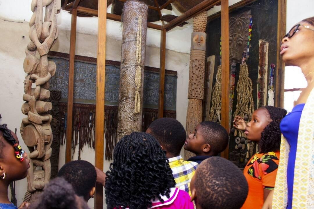 Visitors examining Yoruba cultural exhibits inside the J. Randle Centre in Lagos.