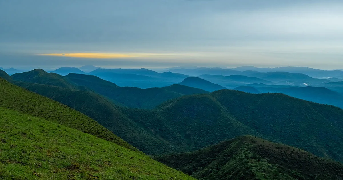 Mist-covered green mountain ridges at Obudu Mountain Resort in Cross River, Nigeria.