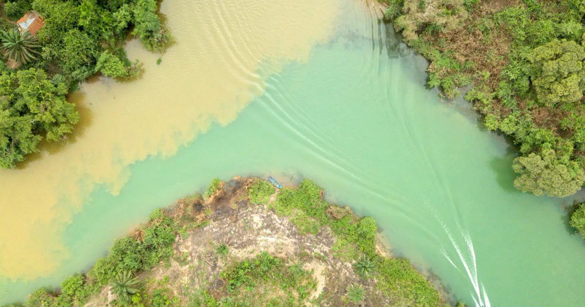 Aerial view of differently coloured waters meeting at the Oguta Lake and Urashi River confluence in Imo State.